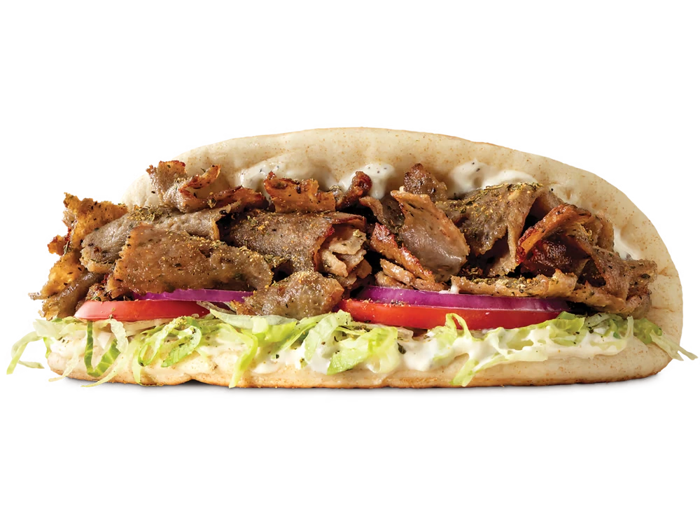 Greek Gyro 1 Greek gyro wrap with meat and vegetables in pita bread.