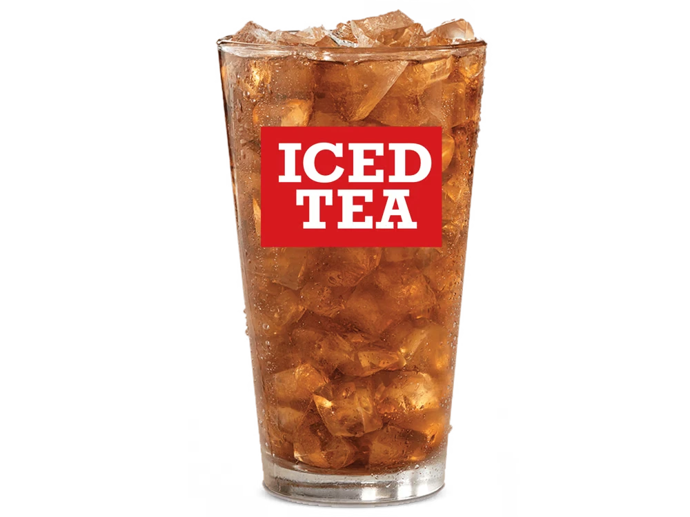 Unsweet Tea 1 A glass of unsweet tea served with ice cubes and lemon slice on a wooden table